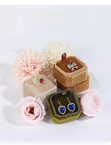 Octagonal velvet jewelry boxes for rings, necklaces, and earrings in various colors