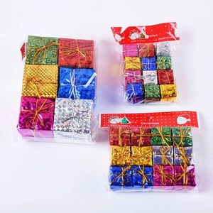 Close-up of assorted colorful foam mini gift boxes in transparent bags for Xmas tree