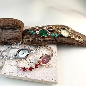 Detailed display of vintage oval quartz bracelet watches in green, gold, silver, and red colors