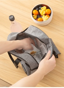 Close-up of easy-to-clean aluminum foil lining in gray insulated lunch bag