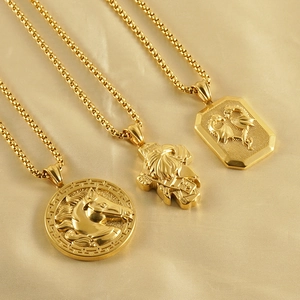 3D gold horse head pendant with lion and dragon charms on silk background