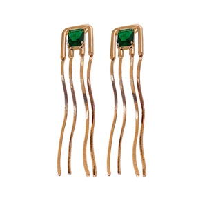 Elegant gold earrings with square green stones and three snake chain tassels on white background
