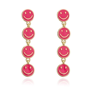 Detailed close-up of pink enamel smile face long drop earrings with gold-tone metal borders