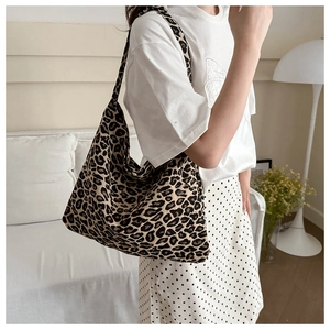 Close-up of leopard print canvas tote bag showing large capacity and soft fabric texture