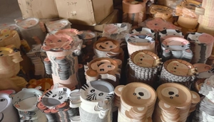 Massive stock of jungle animal shaped paper plates featuring lions, zebras, and monkeys