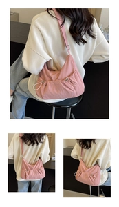 Detail of pink pleated nylon crossbody bag with side drawstring and soft texture