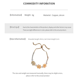 Macro detail of gold flower bracelet with cat eye stones and zircon floral elements