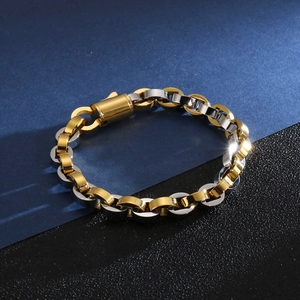 Détail du bracelet à maillons ovales bicolores or et argent avec fermoir cylindrique