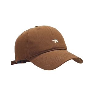 Dark brown cotton baseball cap with white polar bear embroidery in a classic retro style