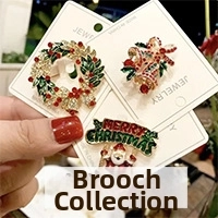 Detailed close-up of a three-piece Christmas brooch set featuring festive enamel designs