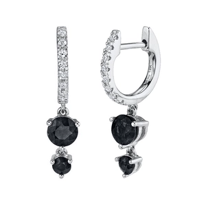 Detailed macro view showing the 14K stamp and pave-set zircons on silver hoop earrings