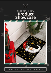 Detailed view of black Christmas moon mat on wood floor with holiday decor items