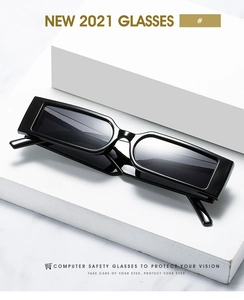 Detailed view of vintage rectangle sunglasses on a minimalist white marble background