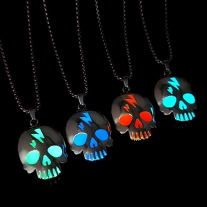 Luminous Halloween skull pendants with lightning teeth in four glowing colors on black base