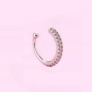 Close-up of rose gold C-shaped ear cuff featuring double rows of pink micro-pave zircons