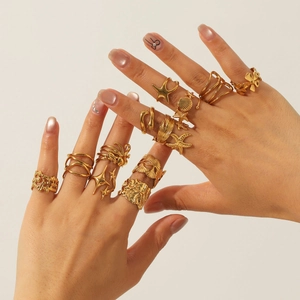 18K gold plated ring set featuring starfish shell and floral motifs on hand