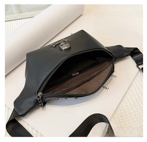 Close-up of the black leather waist bag interior featuring a secure zipper pocket