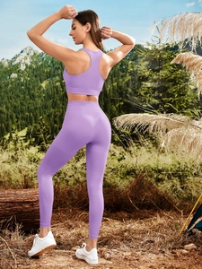Detail of light purple yoga set featuring breathable knit patterns on the back and leggings
