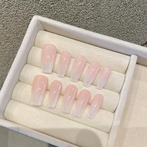 Handmade pink and white ombre coffin press-on nails with glitter finish and glossy top coat