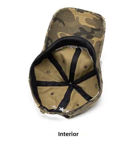 Detail of washed camouflage baseball cap showing inner sweatband and metal buckle
