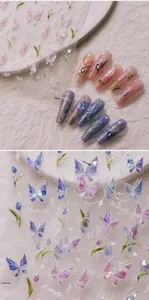 Macro detail of M-362 3D laser nail art stickers with butterfly and tulip floral patterns