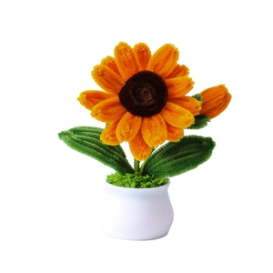 Handmade crochet sunflower potted plant with yellow petals and white pot for desk decor