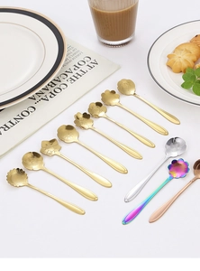 Macro shot of assorted flower-shaped stainless steel coffee spoons on a table
