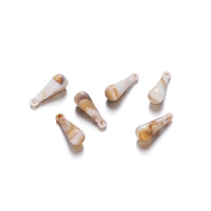Detail of teardrop charms with brown marble patterns for DIY jewelry making