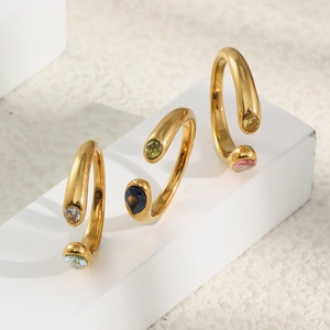 Three gold 18K plated stainless steel snake head rings with faceted zircon stones on stones