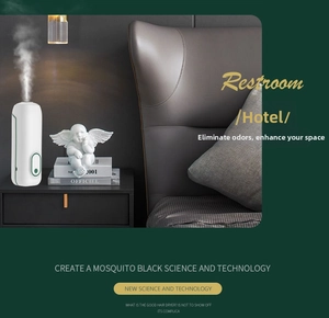 Vertical mist spray detail of white capsule-shaped smart aroma diffuser on nightstand