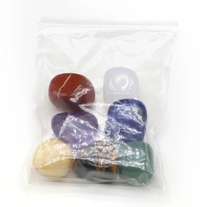 Polished natural crystal set with seven colorful gemstones for energy healing and meditation