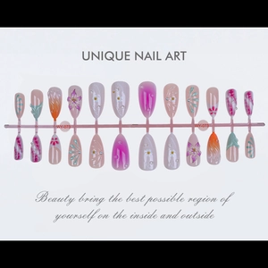 Detail of WY-073 almond press-on nails with 3D floral patterns and pearl accents