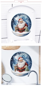 Detail view of Santa Claus snow globe wall stickers applied to a toilet lid and bathroom wall