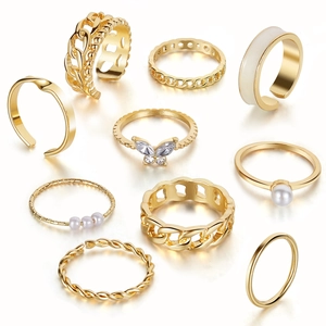 Retro 10-piece gold ring set featuring butterfly and pearls in minimalist aesthetic