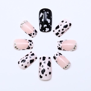 Extra long cow print press-on nails with sparkling rhinestones and pink French tips