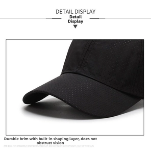 Detail of breathable mesh fabric and reinforced sun-shading brim on the black baseball cap