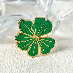 Detailed macro view of the vintage green enamel flower ring with gold plating