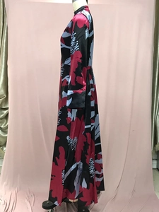 Detail view of the floral print pattern and satin fabric texture on this long A-line dress