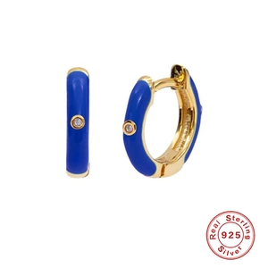 Detail of blue enamel hoop earrings in gold plated silver with sparkling gemstones