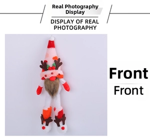 Front view of Christmas gnome plush with reindeer antlers, knit hat and long beard detail
