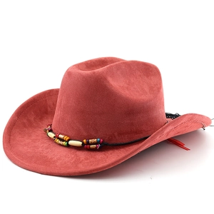 Detail of rust red faux suede cowboy hat featuring colorful beads and fringe trim