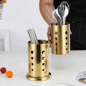 Modern gold stainless steel utensil holder with perforated design and drainage base