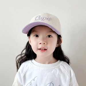 Kids corduroy baseball cap with Cape embroidery and contrast visor on a young model