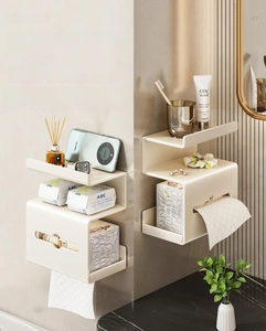 Close-up of cream white S-shaped wall shelf with tiered storage for tissues and toiletries