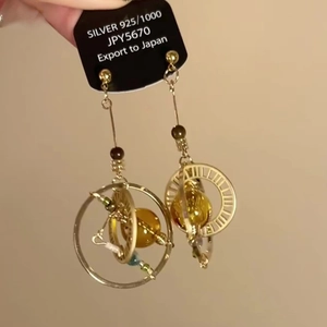 Elegant gold celestial orb drop earrings in 925 silver with a steampunk aesthetic