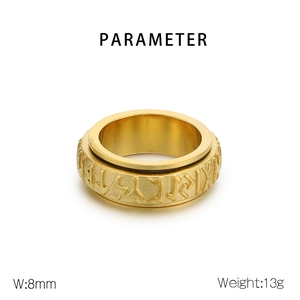 Detail shot of 8mm golden Viking rune spinner ring made of durable stainless steel