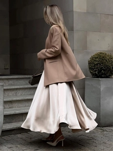 Elegant high waist satin maxi skirt paired with a chic blazer for a sophisticated look