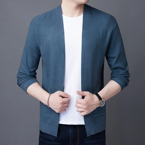 Detail view of men's blue knit cardigan showing fine texture and natural drape style