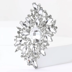 Close-up of large vintage silver alloy brooch with faceted clear glass crystals