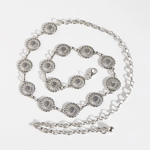 Close-up of silver butterfly waist chain with daisy metal coins and lobster clasp